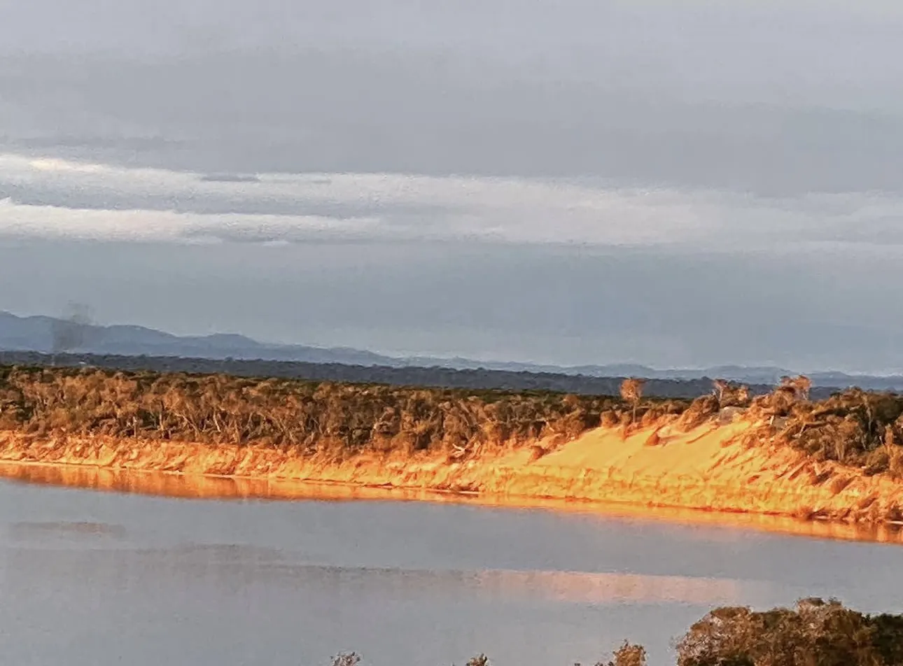 Golden light on the sandy shore of Lake Victoria in the Gippsland Lakes